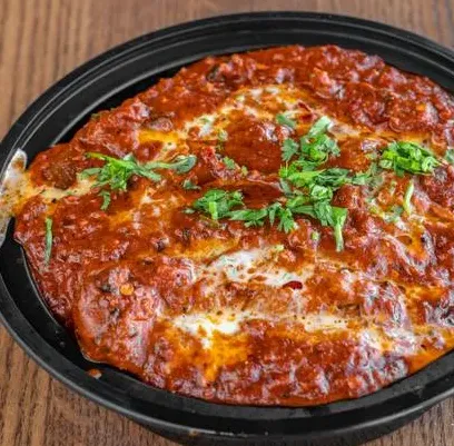 Donair pizza with donair meat, sweet donair sauce, lettuce and diced tomato - Edmonton takeout